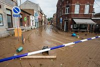 This picture taken in Namur on July 25, 2021 shows the mud covering a street after the heavy rainfall of July 24. - In mid-July western Europe was hit by devastating floods after torrential rains that ravaged entire villages and left at least 209 people dead in Germany and Belgium, as well as dozens missing. The flooding also caused damage in Luxembourg, the Netherlands and Switzerland. (Photo by NICOLAS MAETERLINCK / BELGA / AFP) / Belgium OUT
