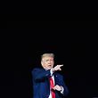US President Donald Trump gestures at supporters during a campaign rally at MBS International Airport in Freeland, Michigan on September 10, 2020. (Photo by MANDEL NGAN / AFP)