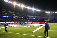 Parc des Princes stadium employees remove a goal in Paris on December 8, 2020 after suspended UEFA Champions League group H football match between Paris Saint-Germain (PSG) and Istanbul Basaksehir FK was postponed on December 9. - Paris Saint-Germain's decisive Champions League game with Istanbul Basaksehir was suspended today in the first half as the players walked off amid allegations of racism by one of the match officials.
The row erupted after Basaksehir assistant coach Pierre Webo, the former Cameroon international, was shown a red card during a fierce row on the touchline with staff from the Turkish club appearing to accuse the Romanian fourth official of using a racist term. (Photo by FRANCK FIFE / AFP)