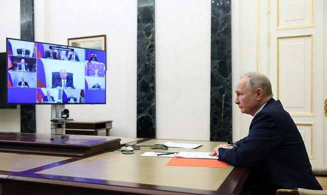 Russian President Vladimir Putin chairs a Security Council meeting via a video link in Moscow on March 24, 2023. (Photo by Gavriil GRIGOROV / Sputnik / AFP)