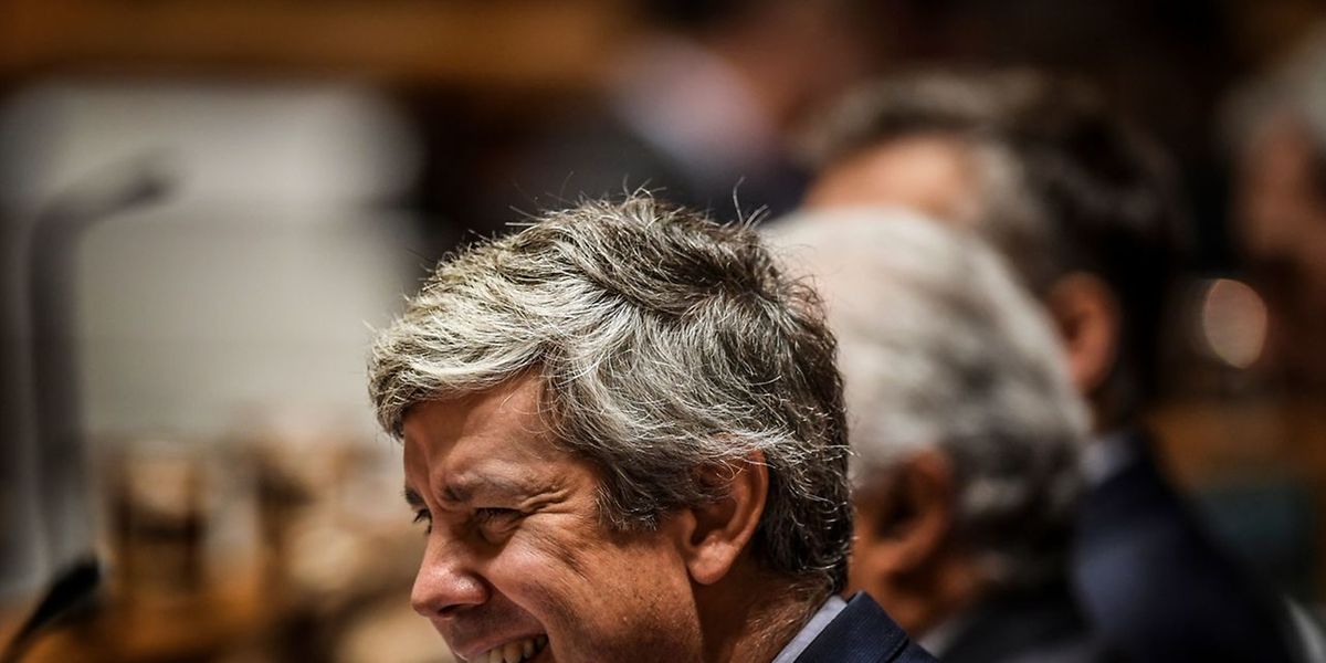 Portuguese Finance Minister Mario Centeno smiles during a plenary session on the day of the final vote of the 2019 State Budget 2019 at the parliament in Lisbon on November 29, 2018. (Photo by PATRICIA DE MELO MOREIRA / AFP)