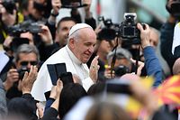 Pope Francis greets worshippers from the popemobile as he arrives to lead a Holy Mass on Macedonia square in Skopje on May 7, 2019. - Pope Francis landed in North Macedonia in a visit delighting a small country whose capital is the proud birthplace of Mother Teresa. People of all faiths have been scooping up the 15,000 tickets to attend the Pope's mass in Skopje's main square, which will be held just down the street from where Mother Teresa was baptised in 1910. Ahead of his visit, Francis praised the mix of cultures, religions and ethnicities in a country that sits at the cross-roads of the East and West. (Photo by Dimitar DILKOFF / AFP)
