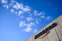 (FILES) In this file photo the Amazon logo at the 855,000-square-foot Amazon fulfillment center is seen in Staten Island, one of the five boroughs of New York City, on February 5, 2019. - A new coalition of small business groups on April 6, 2021 launched a campaign for tougher US antitrust enforcement, specifically calling for the breakup of online commerce titan Amazon. The Small Business Rising group includes the American Booksellers Association, National Grocers Association, and a number of local and regional business organizations. (Photo by Johannes EISELE / AFP)