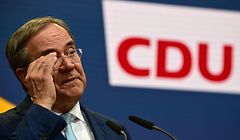 Germany's conservative Christian Democratic Union CDU leader and candidate for chancellor Armin Laschet adjusts his glasses as he gives a press statement in Berlin on October 7, 2021. - The beleaguered chief of Angela Merkel's CDU party signalled on October 7 that he was ready to step aside as leader of the conservatives, after an election debacle that has left them on the brink of the opposition. (Photo by Tobias Schwarz / AFP)