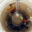 FILE PHOTO -- A US Air Force missile maintenance team removes the upper section of an intercontinental ballistic missile with a nuclear warhead in an undated USAF photo at Malmstrom Air Force Base, Montana. REUTERS/USAF/Airman John Parie/Handout via REUTERS