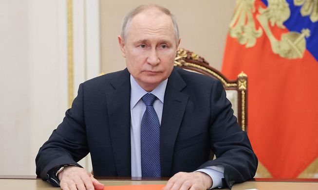 Russian President Vladimir Putin chairs a Security Council meeting at the Kremlin in Moscow on Friday