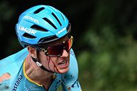 TOPSHOT - Danish rider Jakob Fuglsang rides as he bleeds after a fall in the first stage of the 106th edition of the Tour de France cycling race between Brussels and Brussels, Belgium, on July 6, 2019. (Photo by JEFF PACHOUD / POOL / AFP)