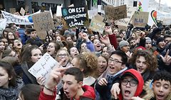 Youths shout slogans during a demonstration in Brussels calling on authorities to take action on climate and ecological issues, on January 24, 2019, as the Chamber at the federal parliament holds a plenary session. (Photo by NICOLAS MAETERLINCK / BELGA / AFP) / Belgium OUT