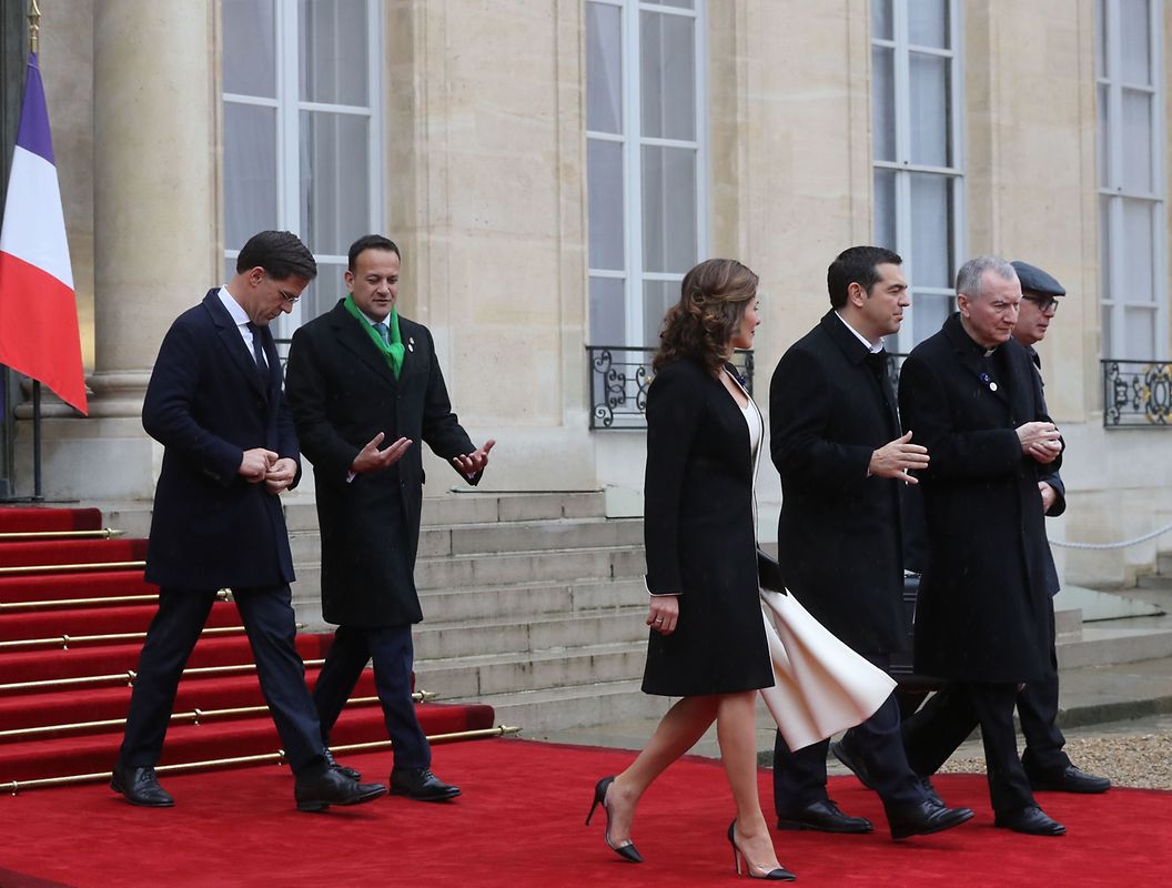 Greek Prime Minister Alexis Tsipras (3rdR) and his partner Betty Batziana (3rdL), Netherland's Prime Minister Mark Rutte (L), Ireland's Prime Minister Leo Varadkar (2ndR) leave the Elysee Palace in Paris on November 11, 2018 for the Arc de Triomphe prior to the start of commemorations marking the 100th anniversary of the 11 November 1918 armistice, ending World War I. (Photo by JACQUES DEMARTHON / AFP)
