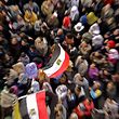 Opposition supporters wave flags amid the crowd in Tahrir Square in Cairo February 9, 2011. Egyptians counted the economic cost of more than two weeks of turmoil on Wednesday as re-invigorated protesters flocked again to Cairo's Tahrir Square to demand President Hosni Mubarak quit immediately. REUTERS/Suhaib Salem  (EGYPT - Tags: POLITICS CIVIL UNREST)