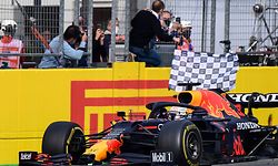 Winner Red Bull's Dutch driver Max Verstappen crosses the finish line during the Emilia Romagna Formula One Grand Prix at the Autodromo Internazionale Enzo e Dino Ferrari race track in Imola, Italy, on April 18, 2021. (Photo by Miguel MEDINA / AFP)