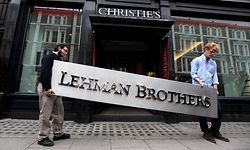 LONDON, ENGLAND - SEPTEMBER 24:  Two employees of Christie's auction house manoeuvre the Lehman Brothers corporate logo, which is estimated to sell for 3000 GBP and is featured in the sale of art owned by the collapsed investment bank Lehman Brothers on September 24, 2010 in London, England. The "Lehman Brothers: Artwork and Ephemera" sale will take place on September 29, 2010, on the second anniversary of the firm's bankruptcy, and comprises of artworks which hung on the walls of Lehman Brothers' offices in Europe.  (Photo by Oli Scarff/Getty Images)