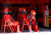 A Ferrari mechanic reacts after Ferrari's Monegasque driver Charles Leclerc crashed during the French Formula One Grand Prix at the Circuit Paul-Ricard in Le Castellet, southern France, on July 24, 2022. (Photo by ERIC GAILLARD / POOL / AFP)