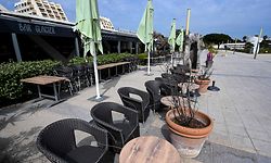 A closed bar-ice cream shop is pictured in the deserted city of La Grande-Motte, south of France, during Easter holidays on April 12, 2020, on the twenty-seventh day of a strict lockdown in France to curb the spread of COVID -19 caused by the new coronavirus. (Photo by Pascal GUYOT / AFP)
