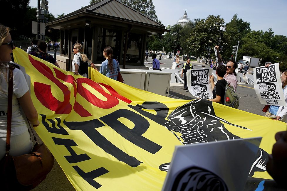 A small group of protesters demonstrate against the Trans-Pacific Partnership (TPP) trade agreement on Capitol Hill 
