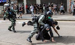 TOPSHOT - Pro-democracy protesters are arrested by police in the Causeway Bay district of Hong Kong on May 24, 2020, ahead of planned protests against a proposal to enact new security legislation in Hong Kong. - The proposed legislation is expected to ban treason, subversion and sedition, and follows repeated warnings from Beijing that it will no longer tolerate dissent in Hong Kong, which was shaken by months of massive, sometimes violent anti-government protests last year. (Photo by ISAAC LAWRENCE / AFP)