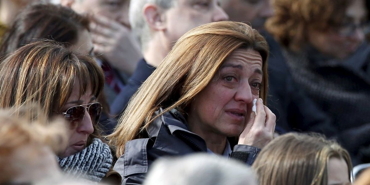 A woman cries during a commemorative ceremony for victims of Germanwings Flight 9525 a day ahead of the first anniversary of the air crash, at Barcelona's airport, Spain, March 23, 2016. REUTERS/Albert Gea      TPX IMAGES OF THE DAY     