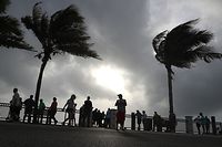 VERO BEACH, FL - SEPTEMBER 02: People stand at the water's edge of the Atlantic Ocean as winds from Hurricane Dorian pick up on September 2, 2019 in Vero Beach, Florida. The Category 5 storm has come to a standstill, parking itself over Grand Bahama Island and unleashing blinding rain, powerful winds and a destructive storm surge but largely sparing the Florida coast for the time being, according to published reports.   Mark Wilson/Getty Images/AFP
== FOR NEWSPAPERS, INTERNET, TELCOS & TELEVISION USE ONLY ==