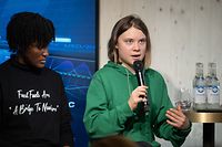 Sweden's activist Greta Thunberg (R) speaks during a session with International Energy Agency chief on the sideline of the World Economic Forum (WEF) annual meeting in Davos, on January 19, 2023. - Thunberg accused attendees of the World Economic Forum in Davos of "fuelling the destruction of the planet" as she arrived at the event in the Swiss Alps. (Photo by Fabrice COFFRINI / AFP)