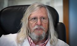 (FILES) In this file photo taken on February 26, 2020 French professor Didier Raoult, biologist and professor of microbiology, specialized in infectious diseases and director of IHU Mediterranee Infection Institute poses in his office in Marseille, southeastern France. - Many people rushed on March 23, 2020 in front of the Marseille's center of expertise on infectious diseases, in order to be tested by the teams of Professor Didier Raoult who recommends treatment with chloroquine. Regarding the treatment in question with chloroquine, according to the French Minister of Health, French High Public Health Council said on March 23, 2020, that the chloroquine could be given to patients suffering from "severe forms" of the COVID-19 (the novel coronavirus) but should not be used for "less severe" forms. (Photo by GERARD JULIEN / AFP)