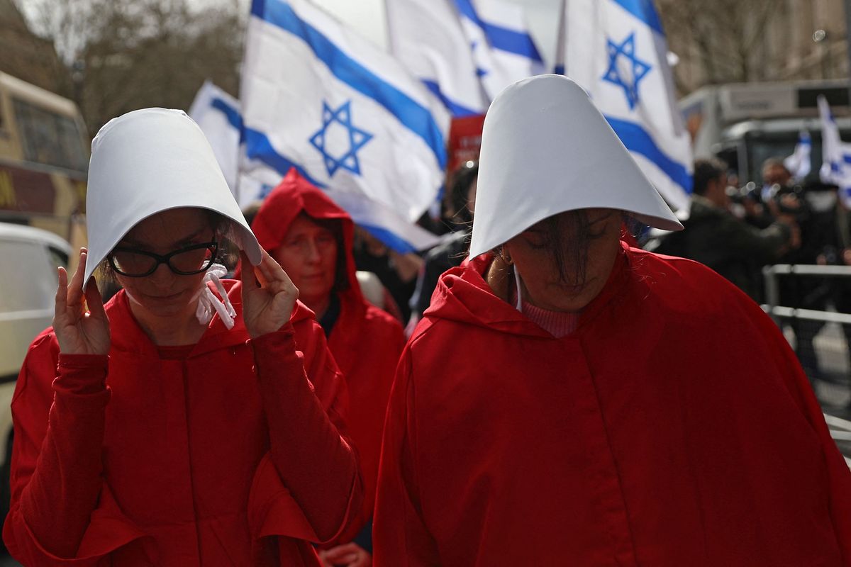 Protesters dressed as characters from The Handmaid's Tale in central London 24 March, 2023