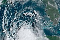 This RAMMB/NOAA satellite shows Hurricane Laura moving Northwestern in the Gulf of Mexico towards Louisiana at 13:00 UTC on August 25, 2020. - Storm Laura was upgraded to a hurricane on August 25, 2020 and is forecast to make landfall along the Texas or Louisiana coasts on Wednesday night, US meteorologists said."Laura has become a hurricane with maximum sustained winds of 75 mph (120 km/h), with higher gusts," the US National Hurricane Center said. "Significant strengthening is forecast during the next 48 hours, and Laura is expected to be a major hurricane at landfall," it added. (Photo by Handout / RAMMB/NOAA/NESDIS / AFP) / RESTRICTED TO EDITORIAL USE - MANDATORY CREDIT "AFP PHOTO / RAMMB/NOAA" - NO MARKETING - NO ADVERTISING CAMPAIGNS - DISTRIBUTED AS A SERVICE TO CLIENTS
