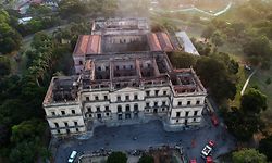 Drone view of Rio de Janeiro's treasured National Museum, one of Brazil's oldest, on September 3, 2018, a day after a massive fire ripped through the building. - The majestic edifice stood engulfed in flames as plumes of smoke shot into the night sky, while firefighters battled to control the blaze that erupted around 2230 GMT. Five hours later they had managed to smother much of the inferno that had torn through hundreds of rooms, but were still working to extinguish it completely, according to an AFP photographer at the scene. (Photo by Mauro Pimentel / AFP)
