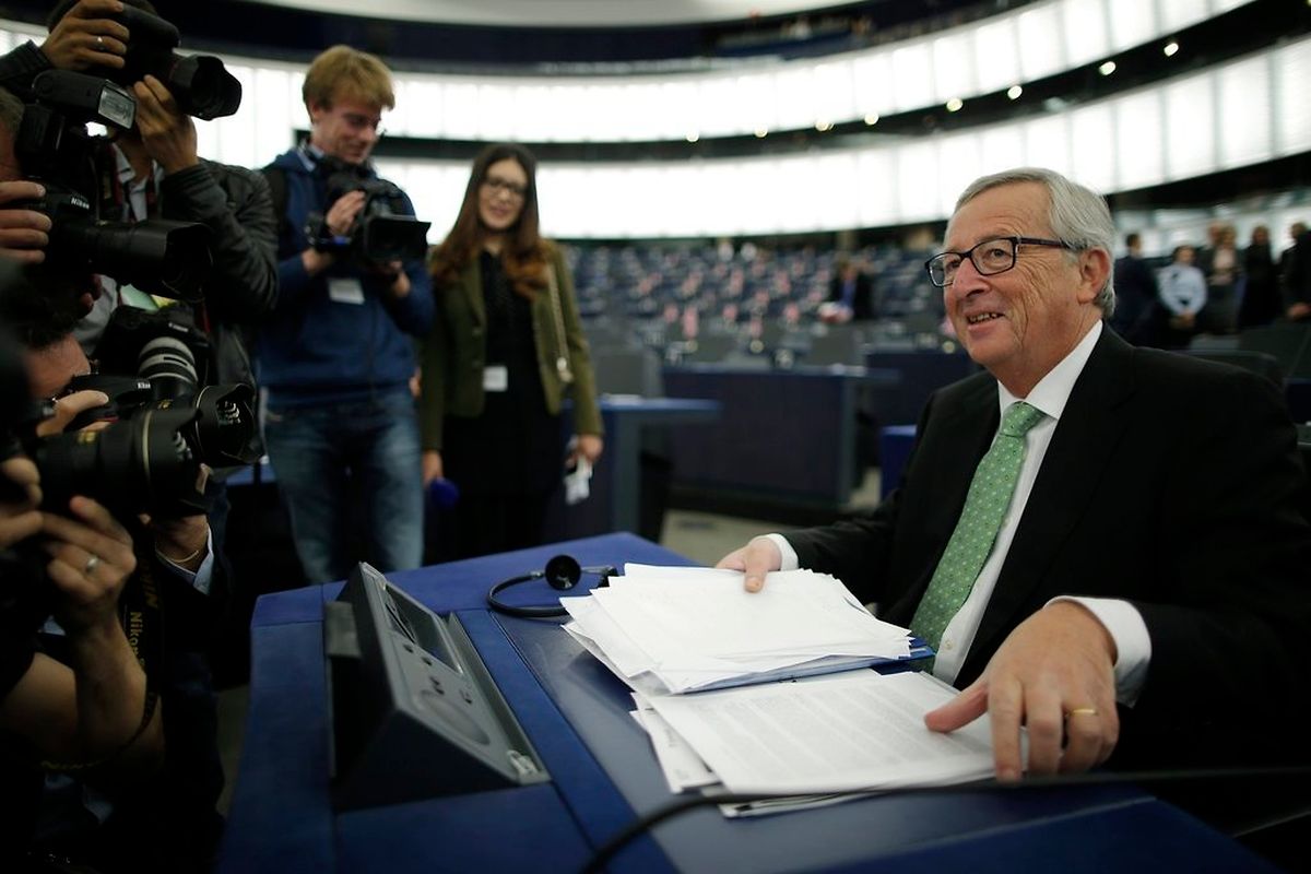 Jean-Claude Juncker, the incoming president of the European Commission, takes his seat as he arrives to attend the presentation of the college of Commissioners and their program during a plenary session at the European Parliament in Strasbourg, October 22, 2014. REUTERS/Christian Hartmann (FRANCE - Tags: POLITICS MEDIA)