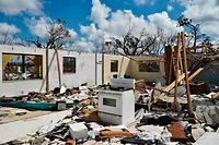 TOPSHOT - A destroyed home is seen at Freeport on Grand Bahama island on September 10, 2019. - Some 2,500 people are unaccounted for in the Bahamas following Hurricane Dorian, the Bahamian National Emergency Management Agency (NEMA) said September 11, 2019. At least 50 people died in the hurricane, which slammed into the northern Bahamas as a Category 5 storm, and officials have said they expect the number to rise significantly. (Photo by Leila MACOR / AFP)