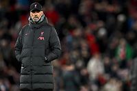 Liverpool's German manager Jurgen Klopp reacts as the players warm up ahead of the UEFA Champions League last 16 first leg football match between Liverpool and Real Madrid at Anfield in Liverpool, north west England on February 21, 2023. (Photo by Paul ELLIS / AFP)