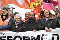 French CGT union general secretary Philippe Martinez (C) and French Union syndicale Solidaires (SUD) union co-general delegates Murielle Guilbert (R) participate in a demonstration, as part of a nationwide day of strikes and protests called by unions over the proposed pensions overhaul, in Paris on March 11, 2023. - The reform proposed by the government includes the raise of the minimum retirement age from 62 to 64 years and the increase of the number of years people have to make contributions for a full pension. Unions have vowed to keep up the pressure on the government, with a seventh day of mass protests, and some have even said they would keep up rolling indefinite strikes. (Photo by Emmanuel DUNAND / AFP)