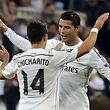 TOPSHOTS
Real Madrid's Portuguese forward Cristiano Ronaldo (R) congratulates teammate Real Madrid's Mexican forward Javier Hernandez (L) after the UEFA Champions League quarter-finals second leg football match Real Madrid CF vs Club Atletico de Madrid at the Santiago Bernabeu stadium in Madrid on April 22, 2015. Real Madrid won 1-0.    AFP PHOTO / GERARD JULIEN