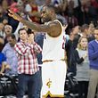 Nov 2, 2015; Philadelphia, PA, USA; Cleveland Cavaliers forward LeBron James (23) acknowledges the crowd after becoming the youngest player in NBA history to record 25,000 career points during the fourth quarter against the Philadelphia 76ers at Wells Fargo Center. The Cavaliers won 107-100. Mandatory Credit: Bill Streicher-USA TODAY Sports