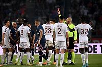 Metz's Malian midfielder Boubacar Traore (4th L) is given a red card by the referee during the French L1 football match between Paris Saint-Germain (PSG) and Metz at the Parc des Princes stadium in Paris on May 21, 2022. (Photo by Anne-Christine POUJOULAT / AFP)