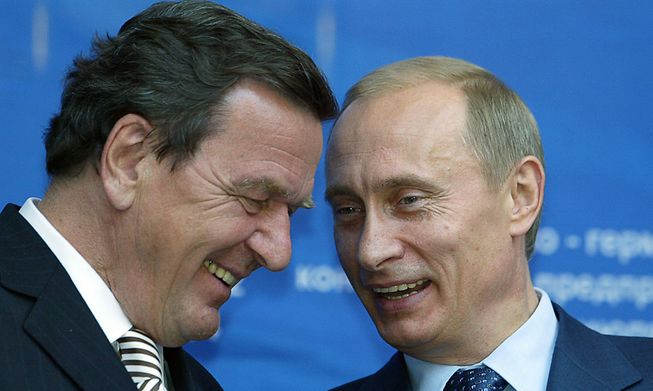 Former German Chancellor Gerhard Schröder, pictured in 2004 with Russian President Vladimir Putin, has ties to several Russian firms