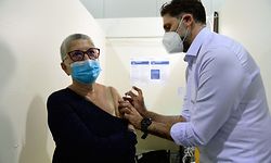 A nurse administers a dose of the  Pfizer/BioNTech Covid-19 vaccine to a member of the public at a vaccination centre set up in the Parc Chanot exhibition centre in Marseille, southeastern France, on April 19, 2021, as part of France's vaccination campaign aimed at stemming the spread of the Covid-19 pandemic. (Photo by Nicolas TUCAT / AFP)