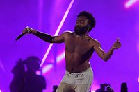 (FILES) In this file photo taken on September 21, 2018 Childish Gambino performs on stage during the iHeartRadio Music Festival at the T-Mobile arena in Las Vegas, Nevada. - Music's biggest stars will gather in Los Angeles on Sunday for the Grammy Awards, and this year observers are hoping the hip-hop and women artists leading the pack will get their due. The industry's annual gala draws eye rolls every year from critics who say the winners are too white and too male, but for the second consecutive year black hip-hop artists dominated the nominations across the board. (Photo by Valerie MACON / AFP)