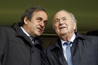 (FILES)-- A file photo taken on May 23, 2013 shows UEFA President Michel Platini (L) and FIFA President Sepp Blatter (R) talking before kick off in the UEFA Women's Champions League Final football match between VfL Wolfsburg and Olympique Lyonnais at Stamford Bridge in London. A FIFA appeal committee on November 18, 2015 rejected a bid by long-time president Sepp Blatter and UEFA chief Michel Platini to overturn their 90-day suspensions while Swiss police pursue a criminal investigation. AFP PHOTO / IAN KINGTON