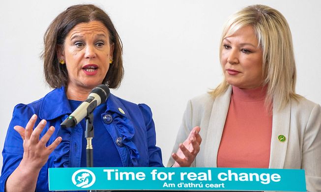 President of the Irish republican Sinn Fein party Mary Lou McDonald  (L) and Deputy First Minister of Northern Ireland and party colleague Michelle O'Neill describe their party's election manifesto in Belfast Monday