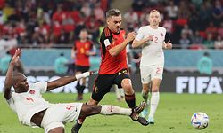 Belgium's forward #17 Leandro Trossard fights for the ball with Canada's defender #04 Kamal Miller during the Qatar 2022 World Cup Group F football match between Belgium and Canada at the Ahmad Bin Ali Stadium in Al-Rayyan, west of Doha on November 23, 2022. (Photo by JACK GUEZ / AFP)