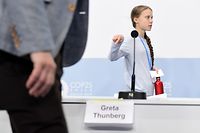 Swedish climate activist Greta Thunberg arrives to hold a press conference with other young activists to discuss the ongoing UN Climate Change Conference COP25 at the 'IFEMA - Feria de Madrid' exhibition centre, in Madrid, on December 9, 2019. - The COP25 summit opened on December 2 with a stark warning from the UN about the "utterly inadequate" efforts of the world's major economies to curb carbon pollution, in Madrid, after the event's original host Chile withdrew last month due to deadly riots over economic inequality. (Photo by CRISTINA QUICLER / AFP)