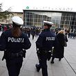 Police officers survey the area in front of the main train station and the Cathedral in Cologne, western Germany, on January 6, 2016, where dozens of apparently coordinated sexual assaults were perpetred against women on New Year's Eve.  / AFP / Roberto Pfeil