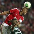 Benfica's player Luisao (R) fights for the ball with Slimani of Sporting's Lisbon during their derby 4th leg soccer match of the Portugal's Cup, at Luz stadium in Lisbon, Portugal, 9th November 2013. MANUEL DE ALMEIDA/LUSA
