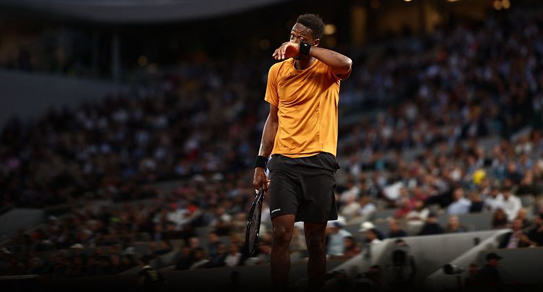 France's Gael Monfils reacts during his match against Argentina's Sebastian Baez during their men's singles match on day three of the Roland-Garros Open tennis tournament at the Court Philippe-Chatrier in Paris on May 30, 2023. (Photo by Anne-Christine POUJOULAT / AFP)