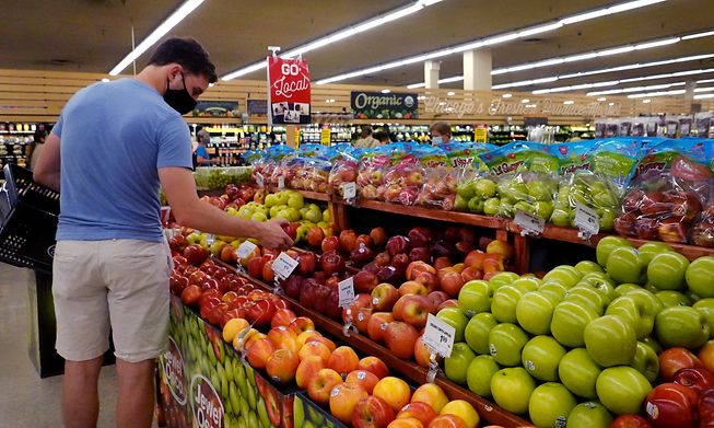 Customers shop for produce at a supermarket on June 10, 2021 in Chicago, Illinois.