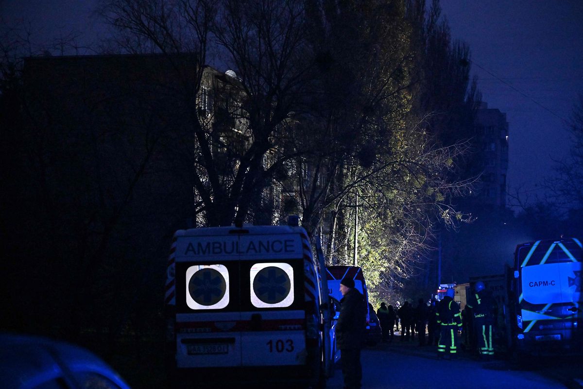 Ukrainian firefighters intervene at the scene where a Russian missile fragment fell in Kyiv, November 15, 2022.