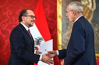 Austria's new Chancellor Alexander Schallenberg (L) shakes hands with Austria's President Alexander Van der Bellen during a swearing-in ceremony at the Presidential Hofburg palace in Vienna, Austria, on October 10, 2021. - Former Foreign Minister Alexander Schallenberg takes over as Austrian chancellor after Sebastian Kurz on October 9, 2021 announced he was stepping down as chancellor following pressure on him to resign after he was implicated in a corruption scandal. (Photo by Joe Klamar / AFP)