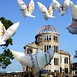 Peace activists fly dove-shaped balloons before the gutted A-bomb dome calling for the abolishment of nuclear arms and for world peace in Hiroshima August 5, 2005, the eve of the 60th anniversary of the world's first atomic bombing of the city.    REUTERS/Eriko Sugita