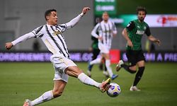 (FILES) In this file photo taken on May 12, 2021 Juventus' Portuguese forward Cristiano Ronaldo controls the ball during the Italian Serie A football match Sassuolo vs Juventus on May 12, 2021 at the Mapei-Citta del Tricolore stadium in Reggio Emilia. - No one can imagine Juventus without the Champions League, and even less Cristiano Ronaldo and his extraordinary salary in the Europa League. The Bianconeri and their star have only 90 minutes left on May 23, 2021 against Bologna to try to escape failure. (Photo by Marco BERTORELLO / AFP)
