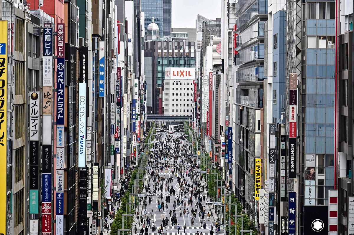 People walk on a street closed to motorists on Sundays in Tokyo's Ginza district on October 11, 2020 Photo: AFP